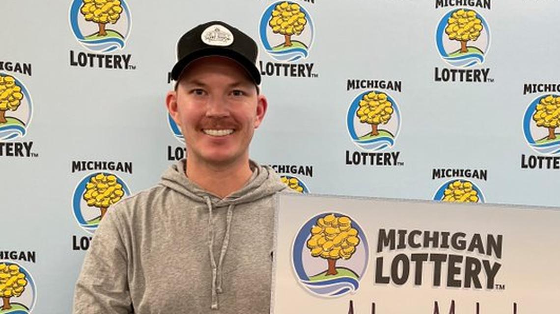 Adam Meloche with his oversized check.