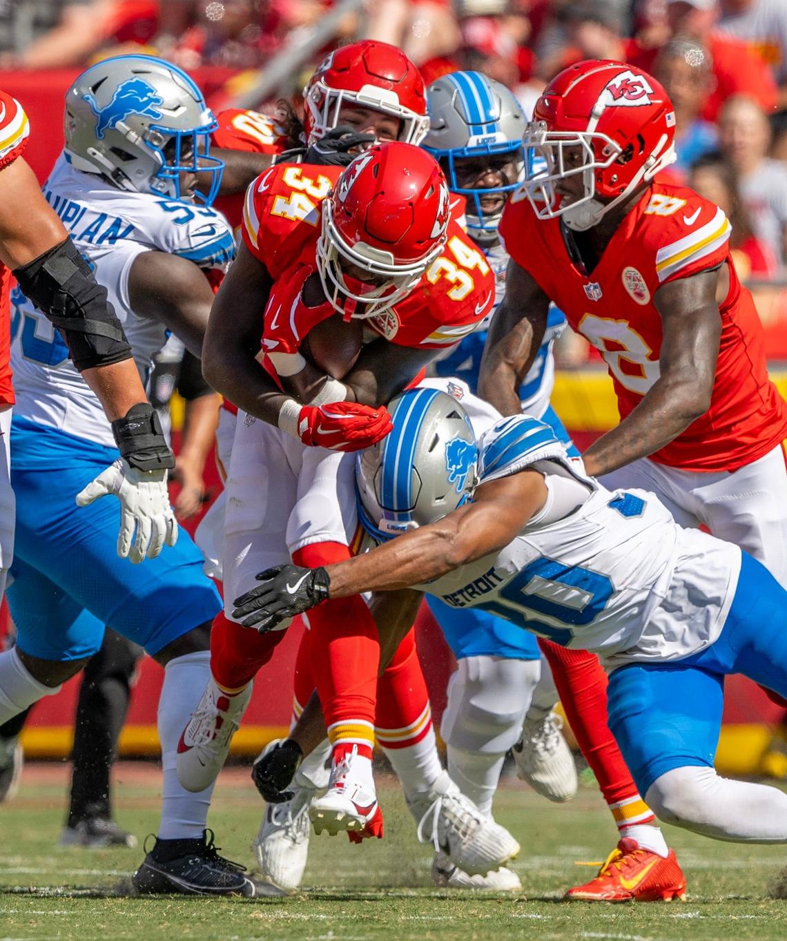 Kansas City Chiefs running back Deneric Prince (34) is tackled by the Detroit Lions defense in the second quarter on Saturday, Aug. 17, 2024, at GEHA Field at Arrowhead Stadium.