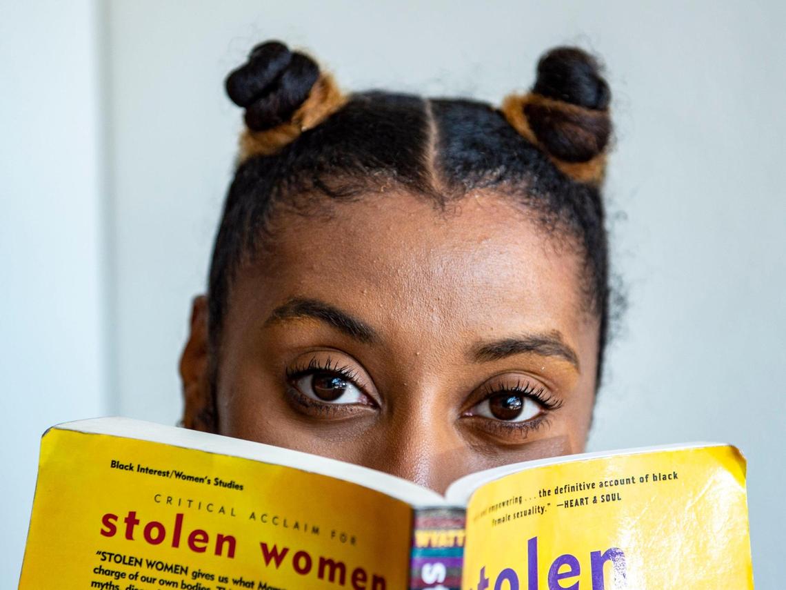 Cori Smith sat in her new bookstore, BLK + BRWN, back in June. “I always was surrounded by Black and brown literature. And so I always was just very interested in Black books, Black authors, stories about people that look like me,” she said.