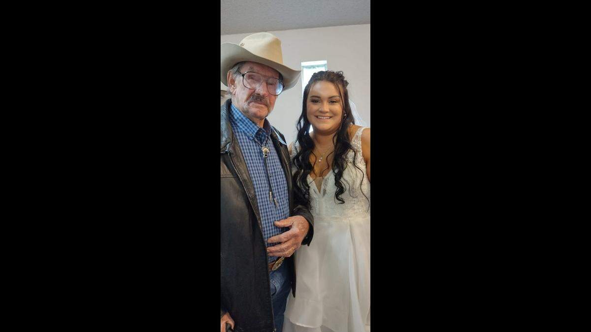 Looking like a refugee from a quality Western movie, Bill Ingram, 91 years old, pauses with his great granddaughter, Mason Brown Evans, to enjoy the moment.