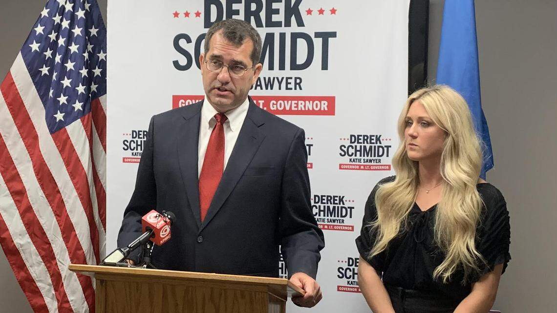 Kansas Attorney General Derek Schmidt, the Republican nominee for governor, holds a news conference with Riley Gaines, a former University of Kentucky swimmer. Schmidt wants the Kansas Legislature to pass a bill banning transgender athletes from girls and women’s sports.