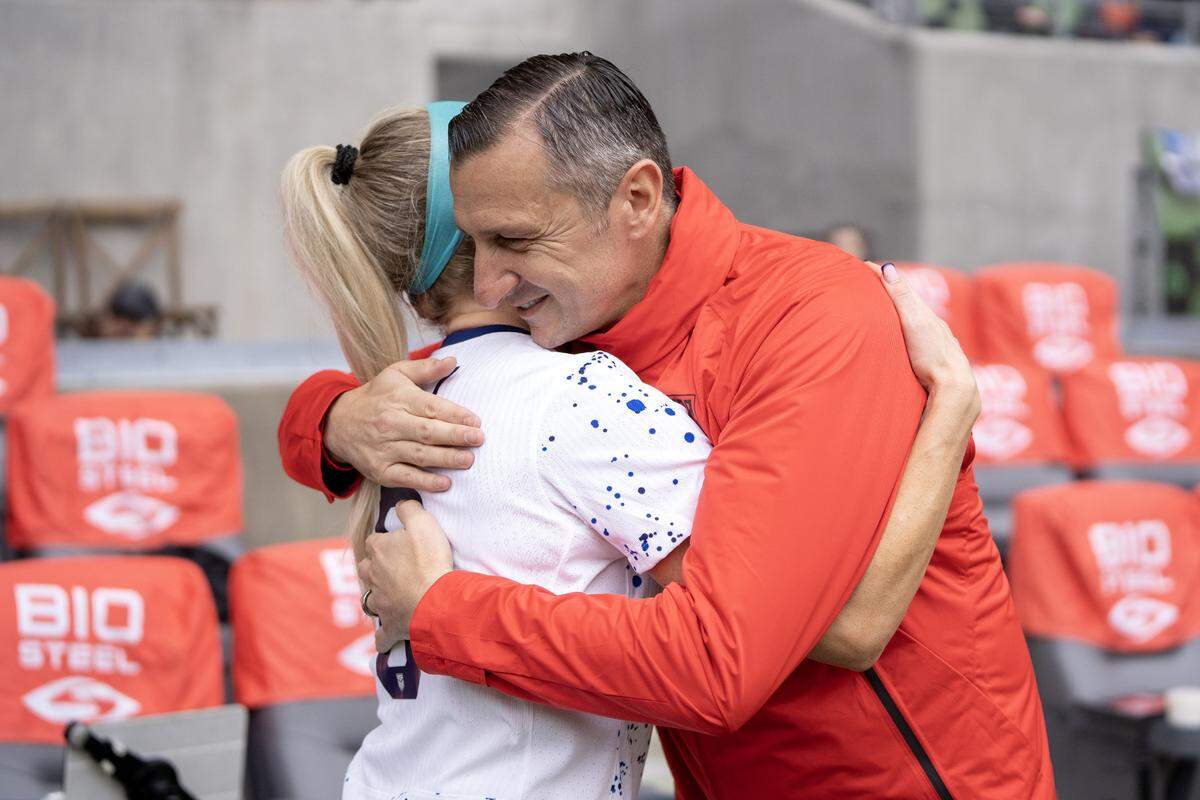 U.S. Women’s National Team coach Vlatko Andonovski hugs midfielder Julie Ertz during an awards ceremony recognizing Ertz’s becoming the 40th American woman to record 100 caps.