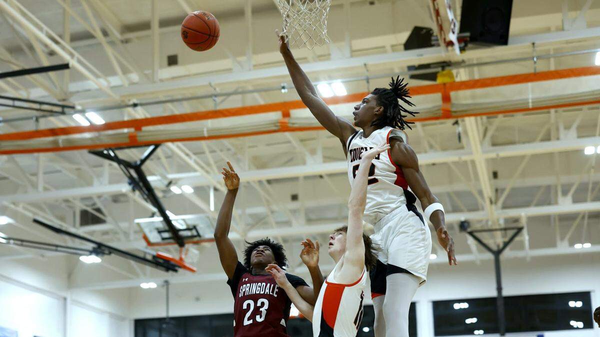 Shawnee Mission Northwest’s Ethan Taylor swats a shot during a 59-43 win over Springdale (Ark.) in the 810 Varsity Showcase on Saturday, Dec. 16, 2023.