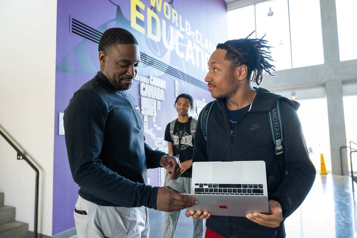 Principal Keith Jones checks on a student's progress inside North Kansas City High School, on Wednesday, March 25, 2026, in North Kansas City. “Northtown” is celebrating 100 years of service to the community this year.