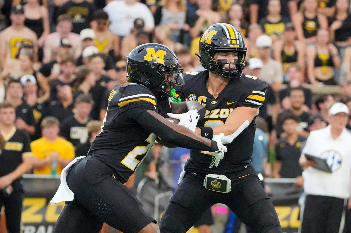 Missouri Tigers quarterback Beau Pribula (9) hands off to running back Ahmad Hardy (29) against the South Carolina Gamecocks during the first half of the game at Faurot Field at Memorial Stadium on Sept. 20, 2025.