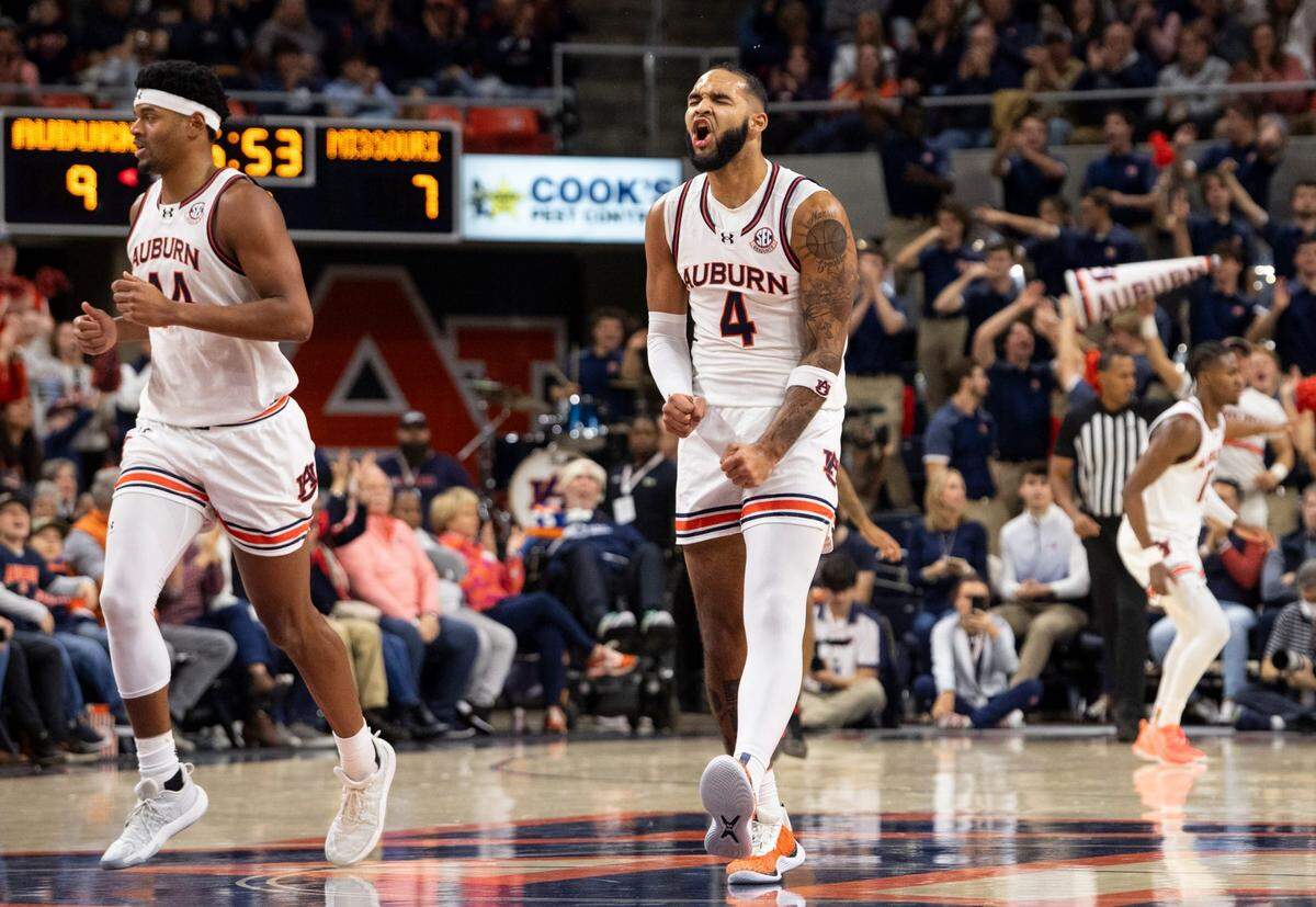 Auburn Tigers forward Johni Broome (No. 4) celebrates a 3-pointer against the Missouri Tigers at Neville Arena in Auburn, Ala., on Saturday, Jan. 4, 2025.