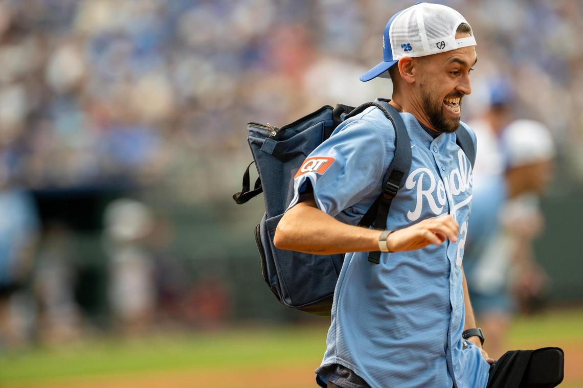 Magician Blake Vogt ran to first base with his bag of tricks during the Big Slick Celebrity Softball game on Friday, May 30, 2025, at Kauffman Stadium in Kansas City.