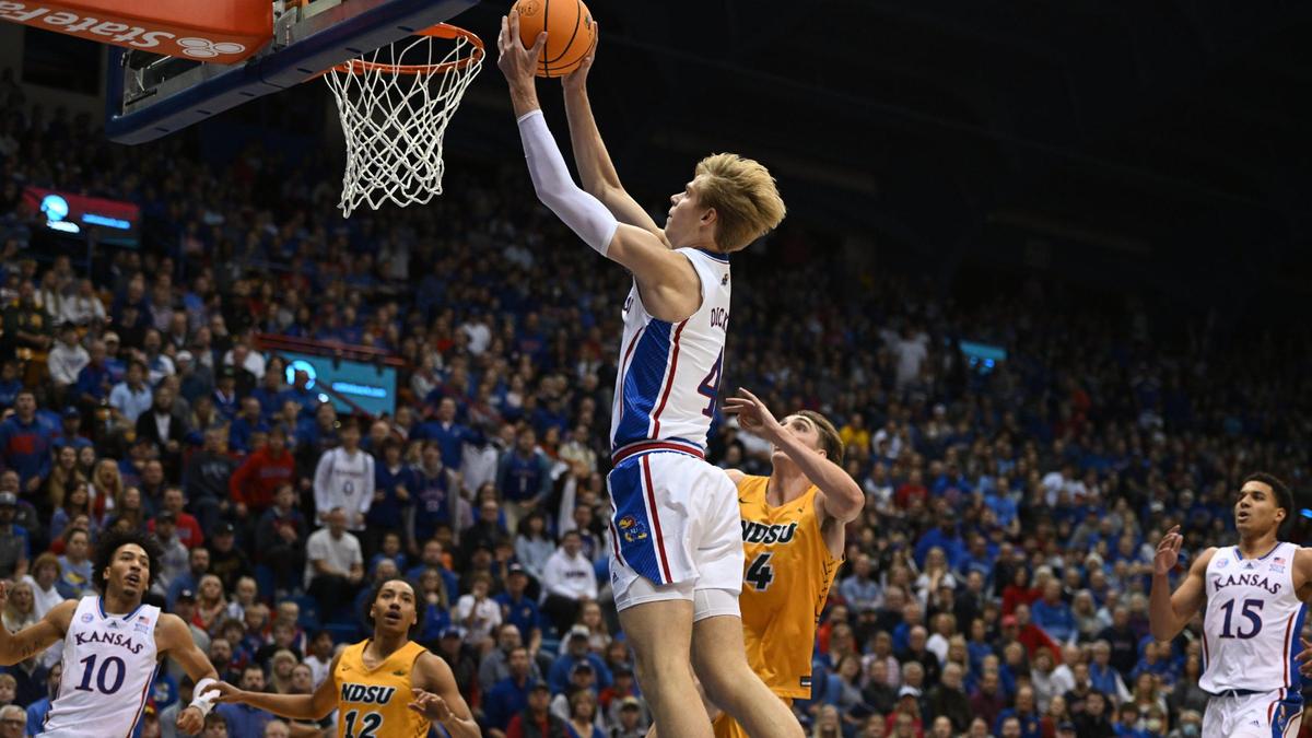 KU’s Gradey Dick got by NDSU’s Grant Nelson for a bucket during the first half of Thursday night’s game at Allen Fieldhouse.