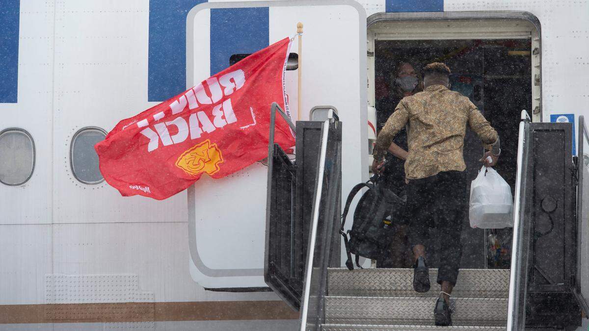 Kansas City Chiefs wide receiver Tyreek Hill bounded up stairs at Kansas City International Airport Saturday to join his teammates on a plane going to Tampa, Florida, where the Chiefs will play in Super Bowl LV.