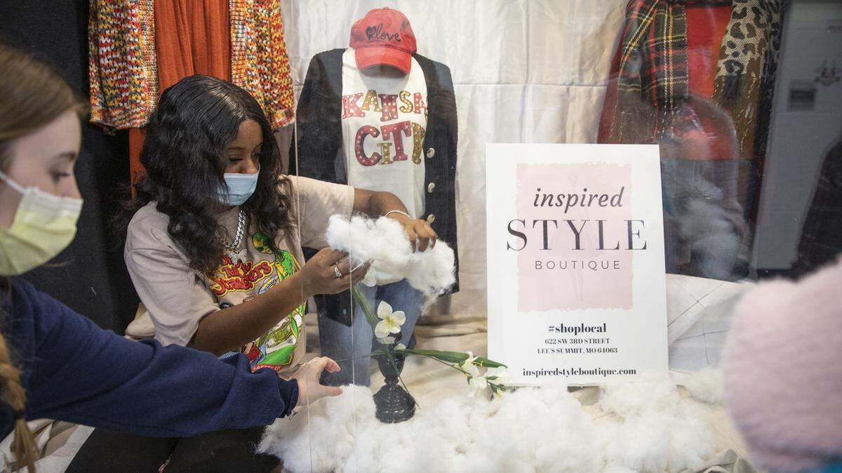 Kassidy McQueen and Ra’Niyah Holmes put together a display case at Lee’s Summit North High School as part of their partnership with Inspired Style Boutique for their advanced fashion design and construction class.