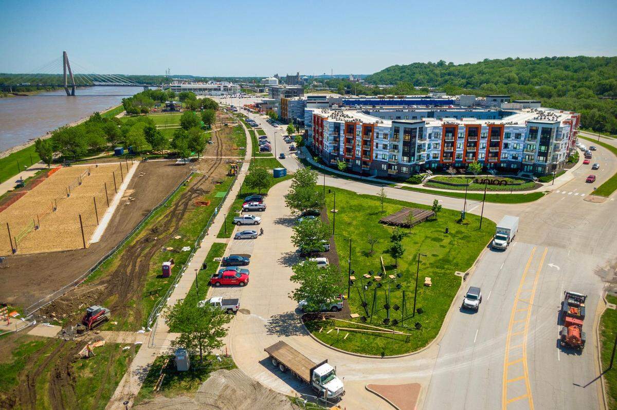 The Union Berkley Riverfront apartments are on the right. To the left are the new sand volleyball courts. That torn earth between them is where the streetcar tracks will go.
