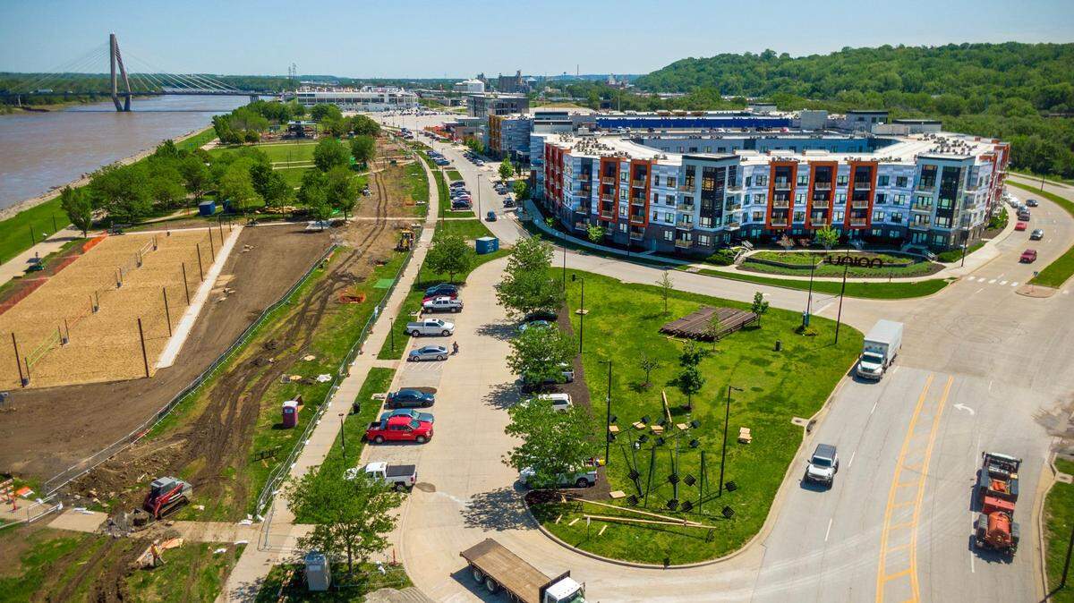The Union Berkley Riverfront apartments are on the right. To the left are the new sand volleyball courts. That torn earth between them is where the streetcar tracks will go.
