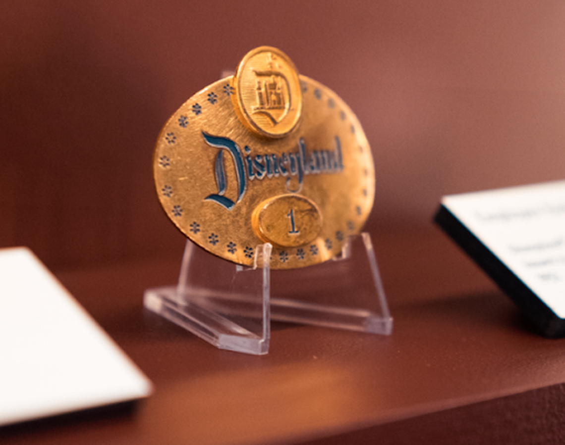 The first Disneyland employee badge was issued to Walt Disney in 1955. It is part of the Disney100 exhibit now being set up inside Union Station.
