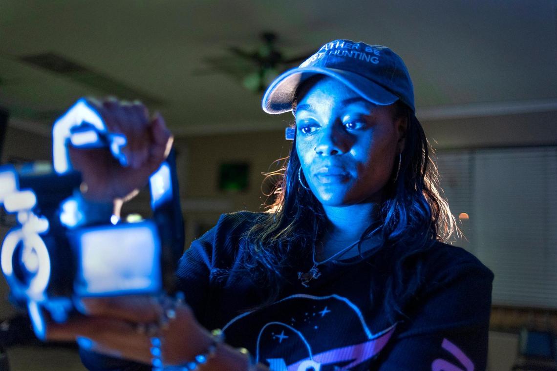 Marie Jackson uses an infrared camera to search for signs of paranormal activity at a Kansas City barbershop.