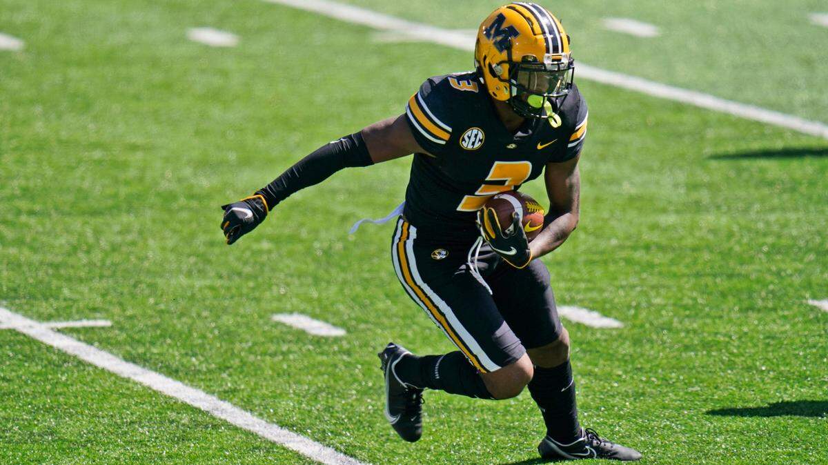 Missouri wide receiver Luther Burden III runs with the ball during an NCAA college football intra-squad spring game Saturday, March 19, 2022, in Columbia, Mo. (AP Photo/Jeff Roberson)