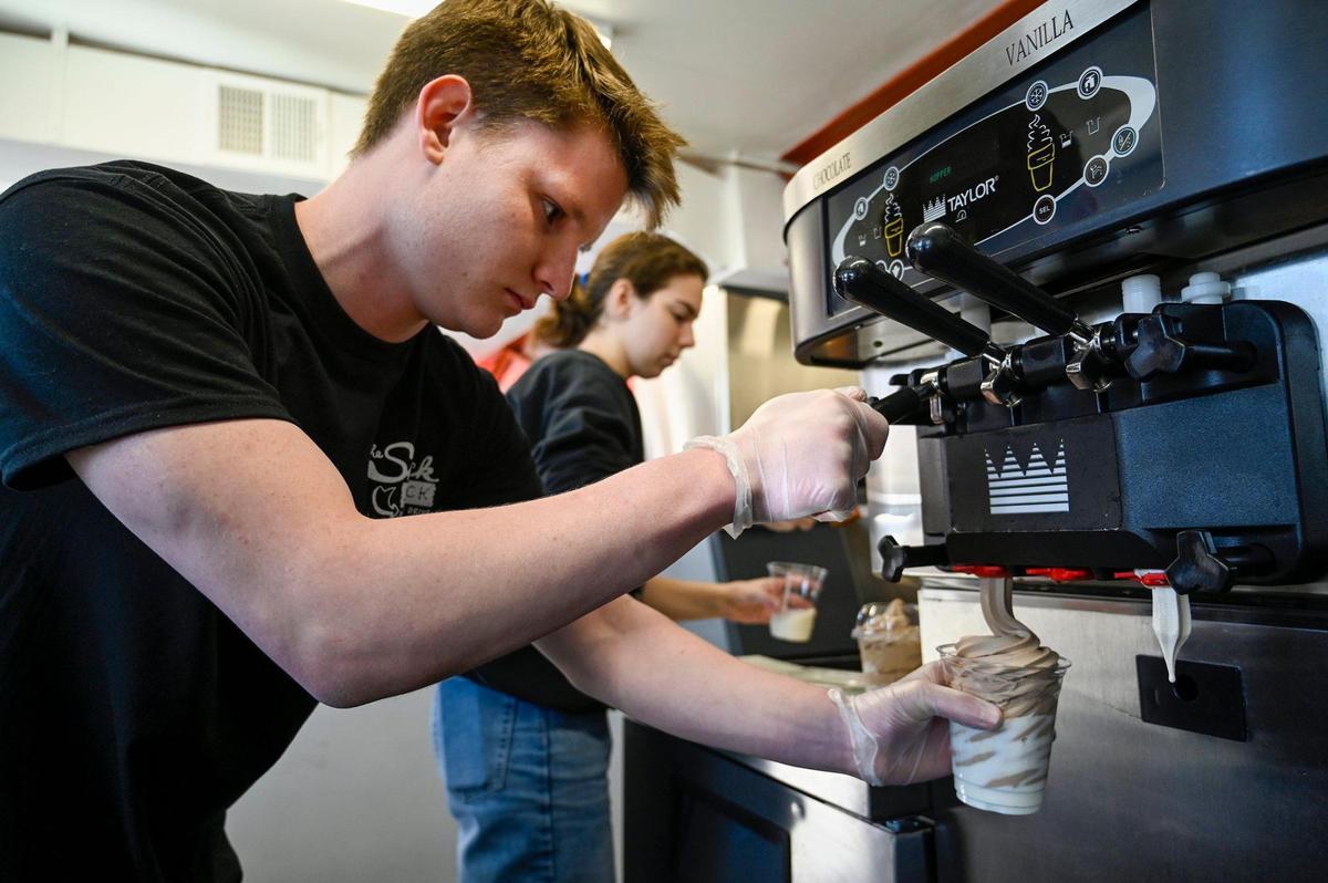 Sam Sublette, left, and Brooke Beauchamp, handle the frozen shakes and malts at The Snack Shack on Johnson Drive during a soft opening on Saturday, March 26.