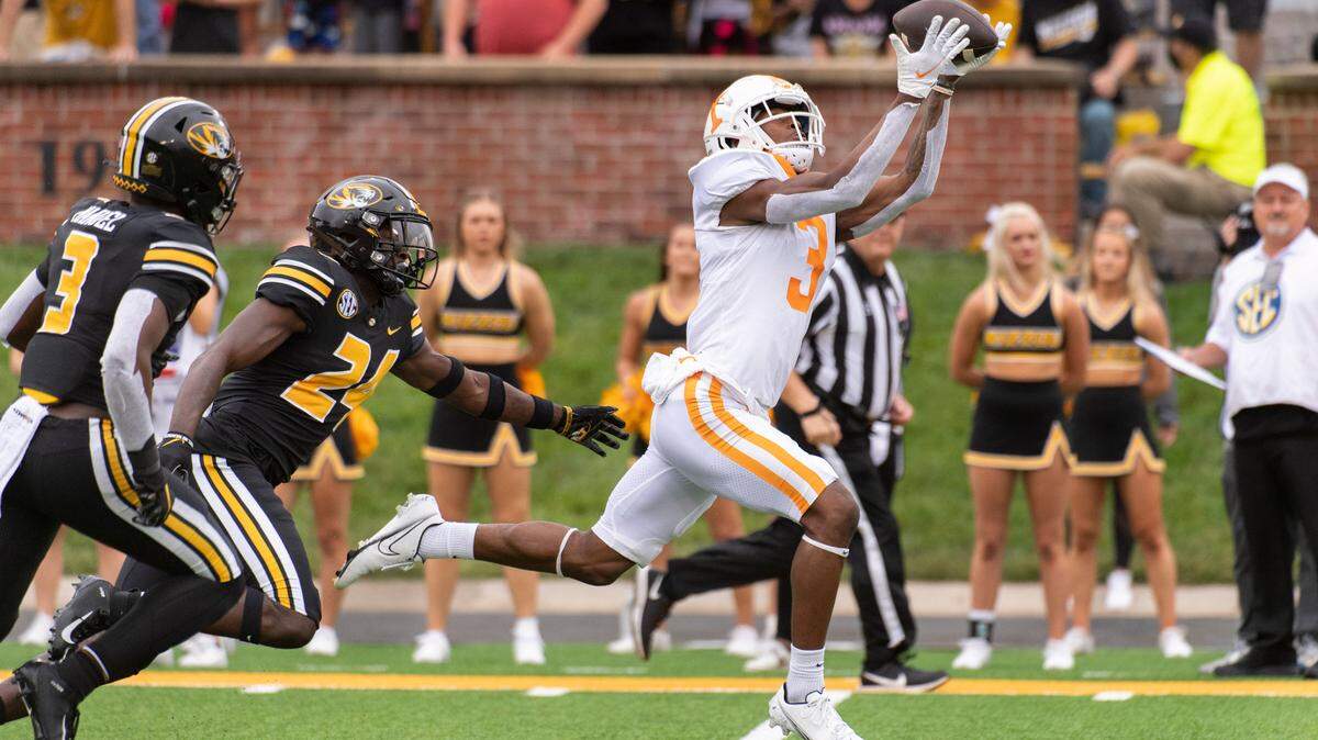 Tennessee wide receiver JaVonta Payton, right, catches a touchdown pass in front of Missouri defensive back Martez Manuel, left, and Allie Green IV, center, during the first half of an NCAA college football game Saturday, Oct. 2, 2021, in Columbia, Mo. (AP Photo/L.G. Patterson)