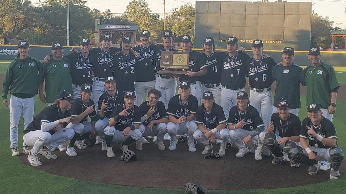 The Class 5A state champion Blue Valley Southwest baseball team poses for a photo after winning the first-place trophy.