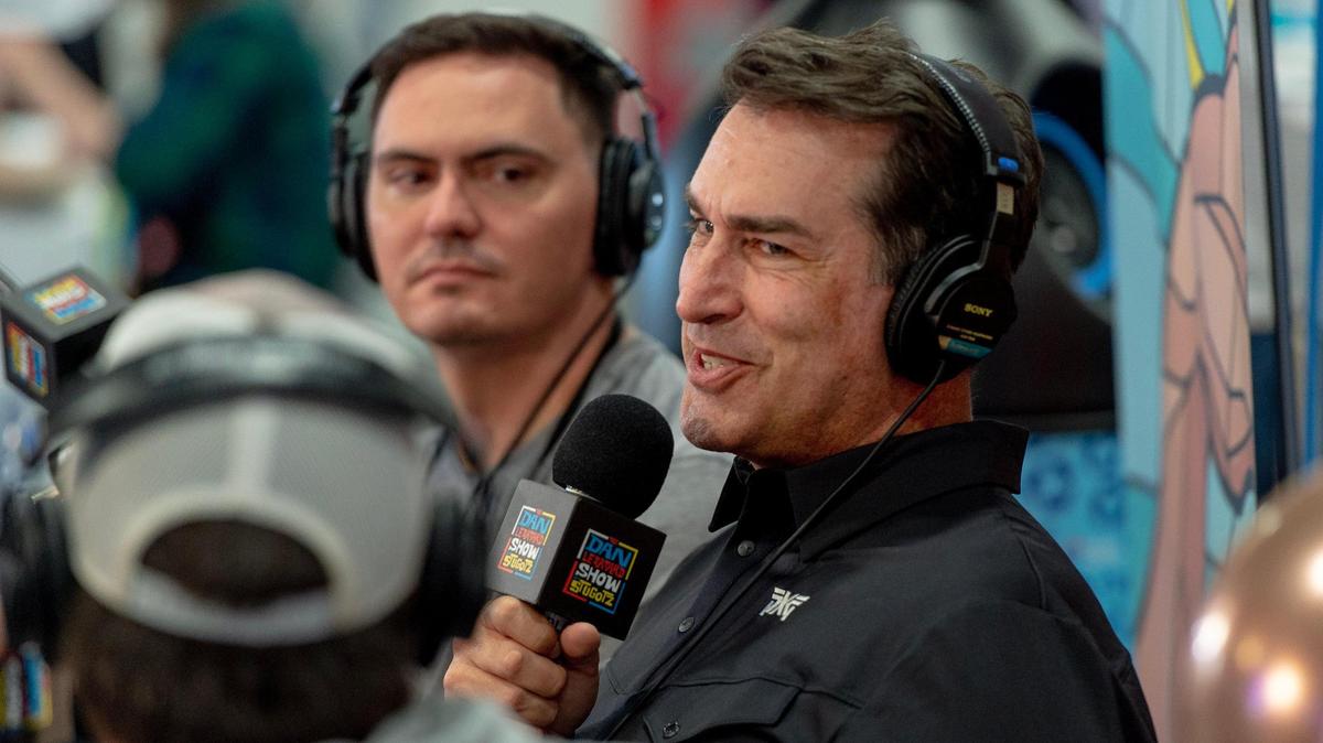 Actor and Kansas City Chiefs fan Rob Riggle talks on a podcast at Super Bowl LVII’s Media Row on Friday, Feb. 10, 2023, in Phoenix, Ariz.