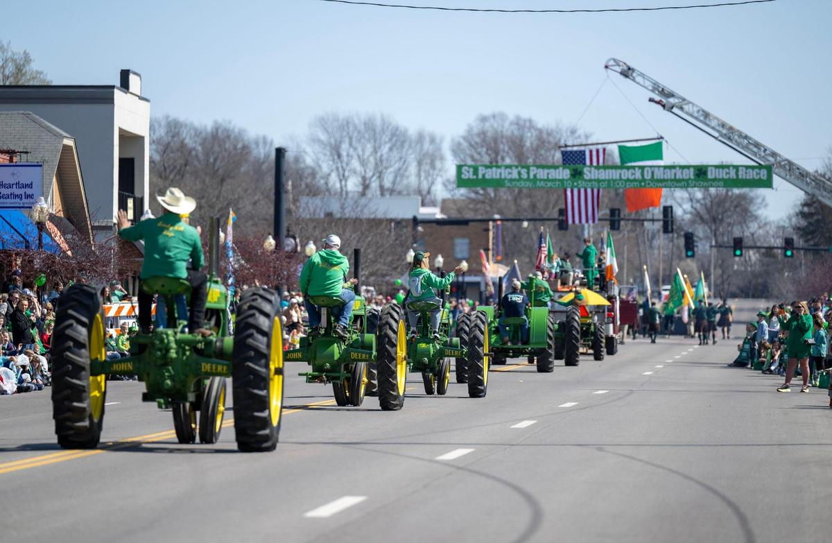 Vintage John Deere tractors rolled along Johnson Drive as people gathered to watch for the 38th annual Shawnee St. Patrick’s Day Parade on Sunday, March 10, 2024.