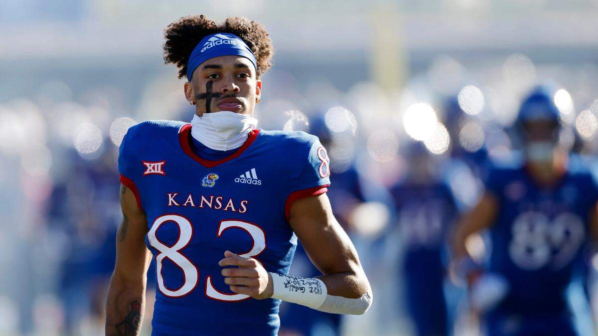 Kansas wide receiver Quentin Skinner (83) and his teammates take the field before a game against Texas on Saturday, Nov. 19, 2022, in Lawrence, Kan.