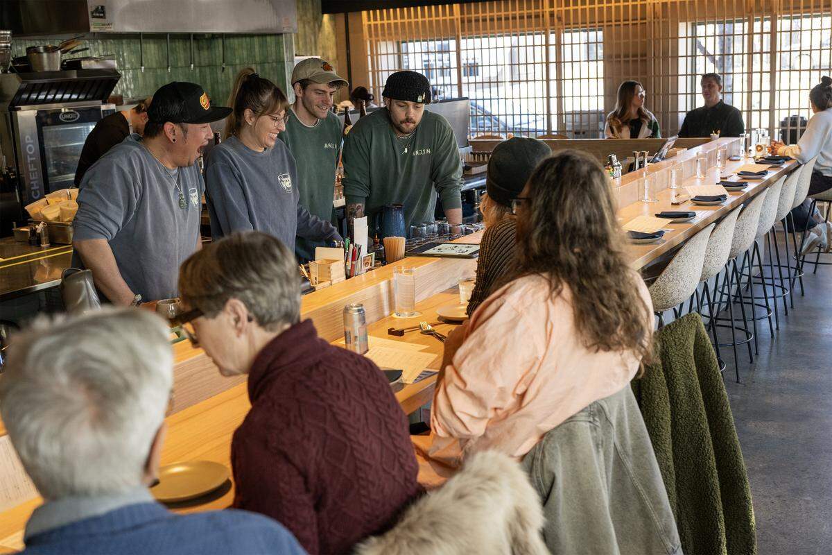 Leslie Goellner sports a custom-designed shirt at Anjin, a 20-seat Japanese Izakayas-style restaurant, 1708 Oak St. in Kansas City. Anjin was named a 2026 James Beard Foundation “Best New Restaurant” semifinalist. It's owned by Nick and Leslie Goellner of The Antler Room with partner Drew Little.