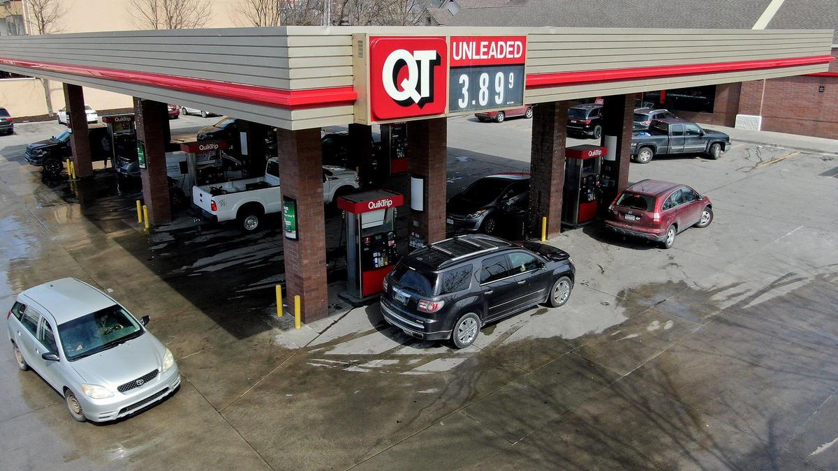 Drivers fill up at the QuikTrip on Main Street and E. 44th Street Kansas City Tuesday, Mar. 8, 2022. After the United States banned Russian oil into the country to punish Russia for its invasion of Ukraine, U.S. gas prices have hit a record.
