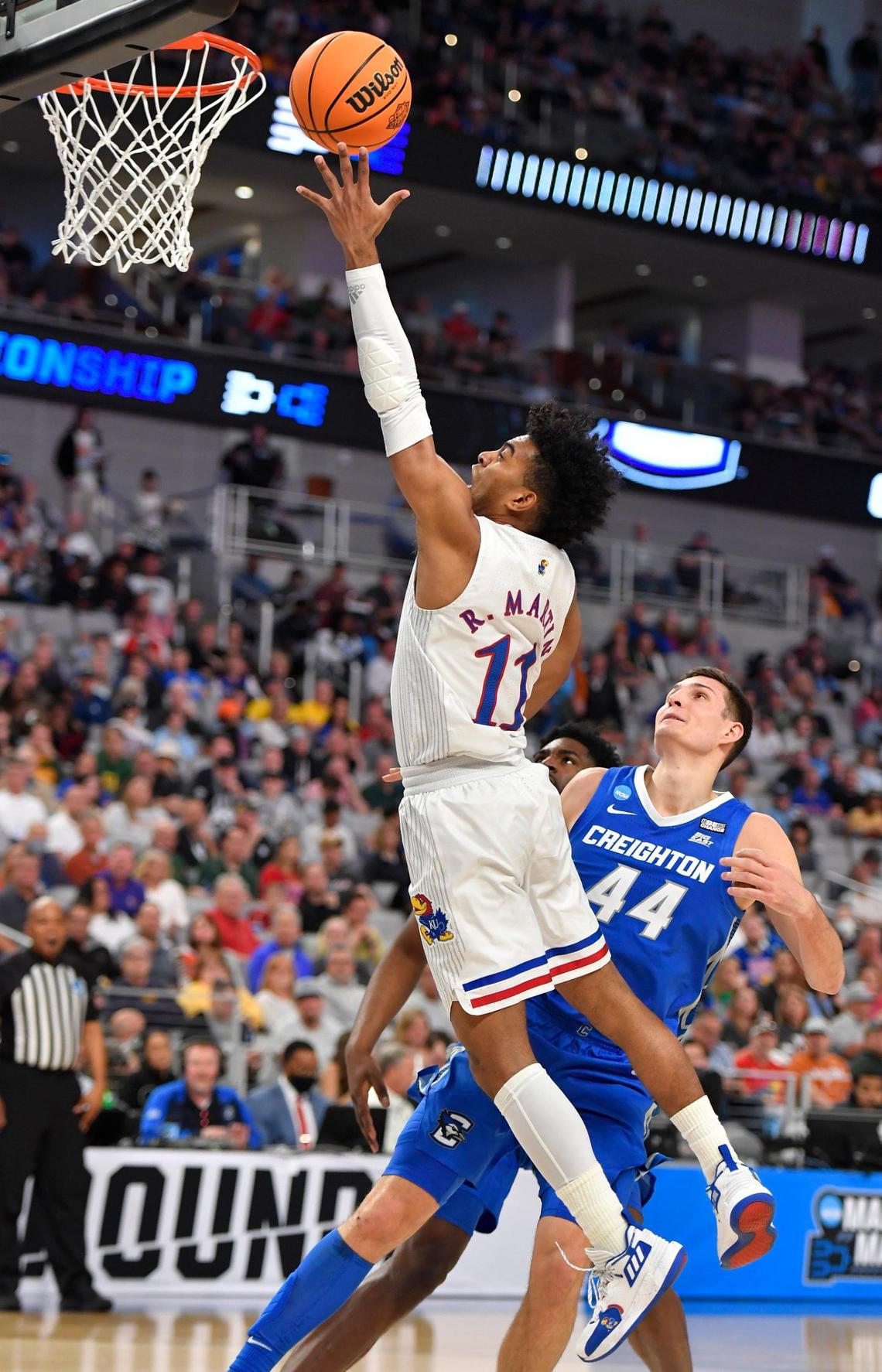 KU’s Remy Martin drives on Creighton’s Ryan Hawkins during the first half of Saturday’s second-round NCAA Tournament game in Fort Worth, Texas.