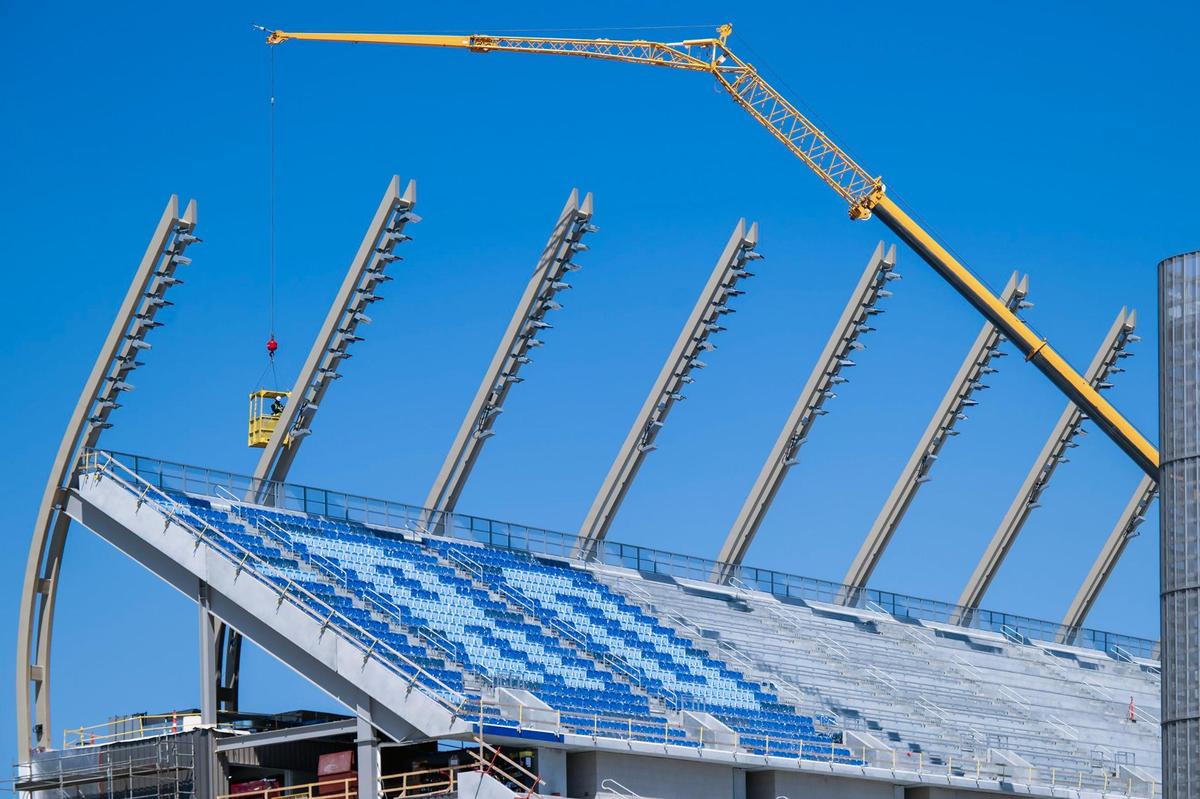 A contractor works on lighting as part of the renovations to David Booth Kansas Memorial Stadium on Friday, April 11, 2025, at the University of Kansas in Lawrence. The renovated stadium is scheduled to be ready for the 2025 football season with the home opener set for Saturday, August 23, 2025, against Fresno State.