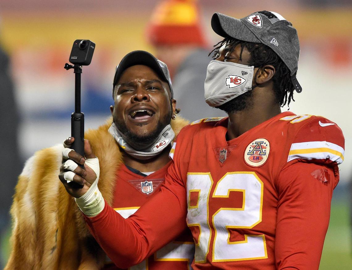 Kansas City Chiefs defensive end Frank Clark and defensive end Tanoh Kpassagnon record themselves after the Kansas City Chiefs defeated the Bills 38-24 to win AFC Championship Game at Arrowhead Stadium Sunday Jan. 24, 2021. The Chiefs will return to the Super Bowl.
