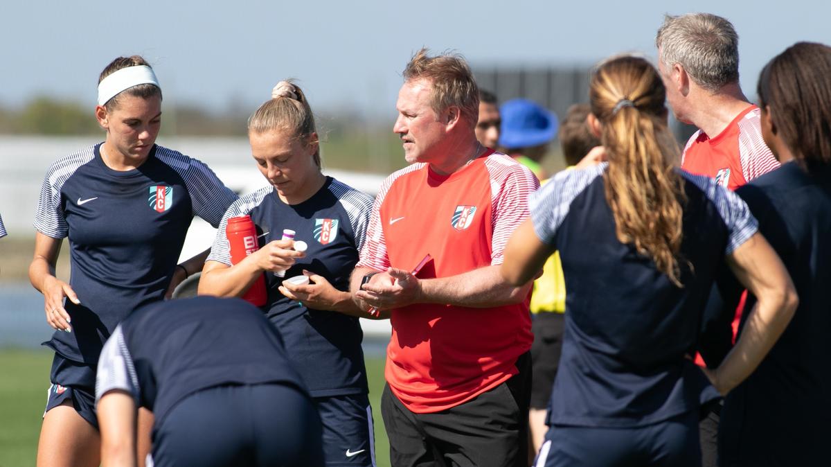 Kansas City Current coach Matt Potter gathered with his players after they beat the Washington Spirit 6-0 in a Saturday preseason game in Bradenton, Florida.