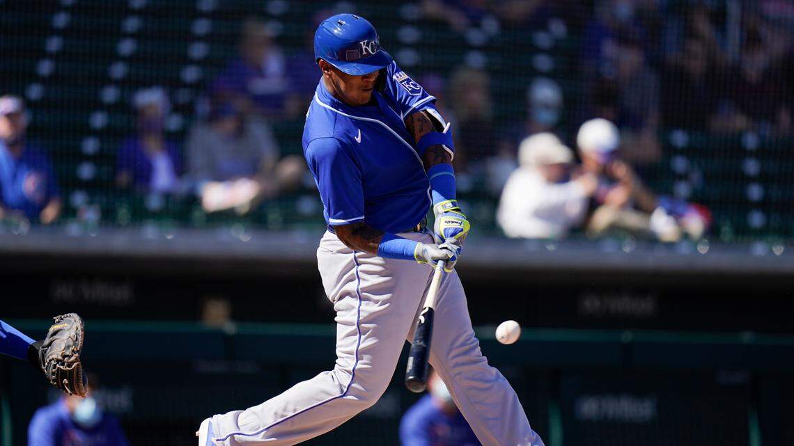 Kansas City Royals’ Salvador Perez hits a fly ball during the first inning of a spring baseball game against the Chicago Cubs in Mesa, Ariz., Tuesday, March 2, 2021. (AP Photo/Jae C. Hong)