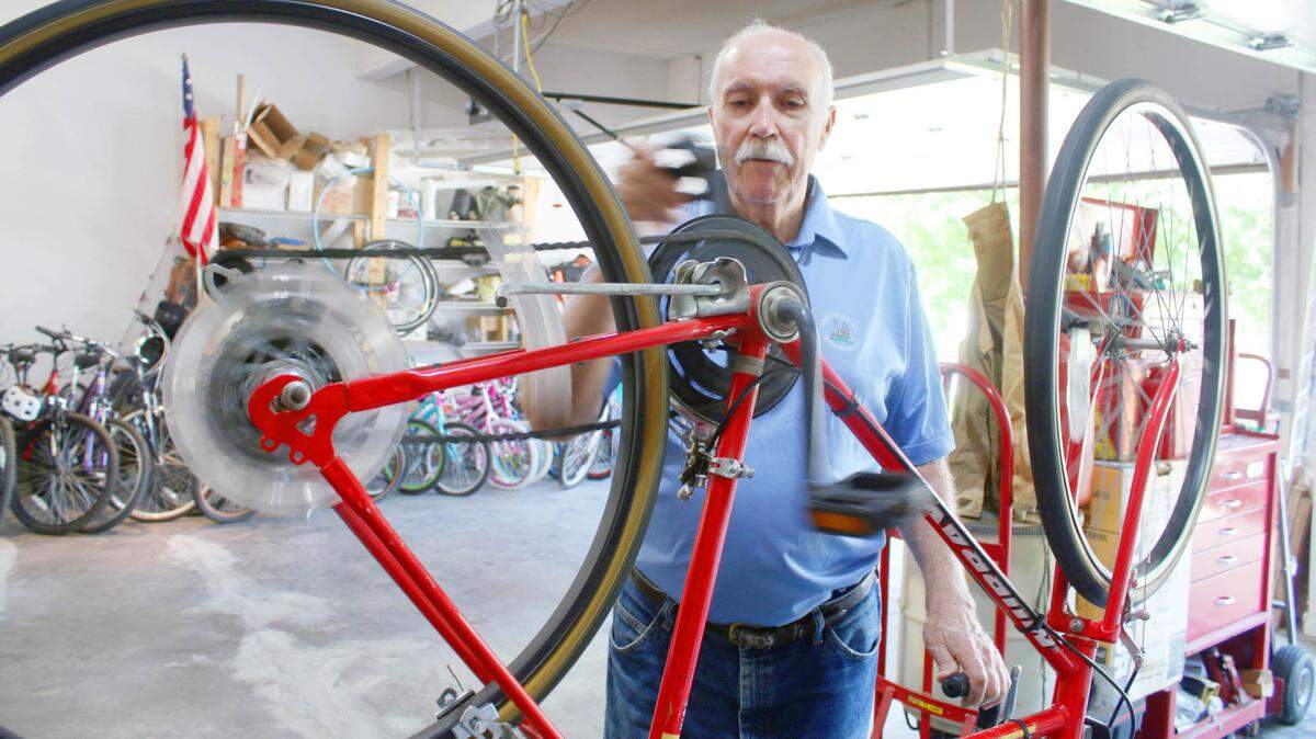 In his Overland Park garage, Ballard Yeates is always working on a bike to give to a child in foster care.