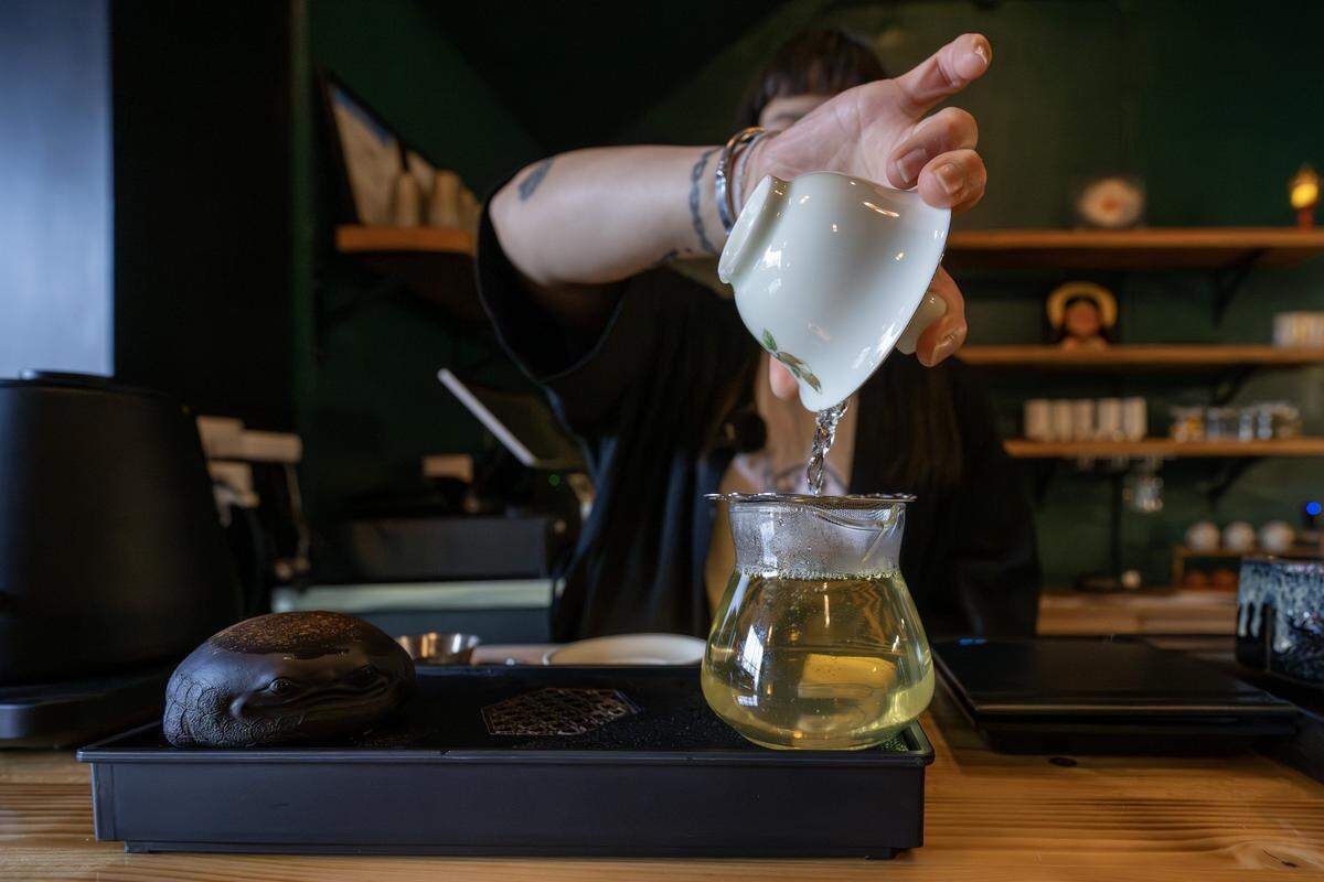 Saranya Hubbard, co-owner of Moon Bar KC, prepares a green tea on Tuesday, Dec. 16, 2025, in Kansas City.