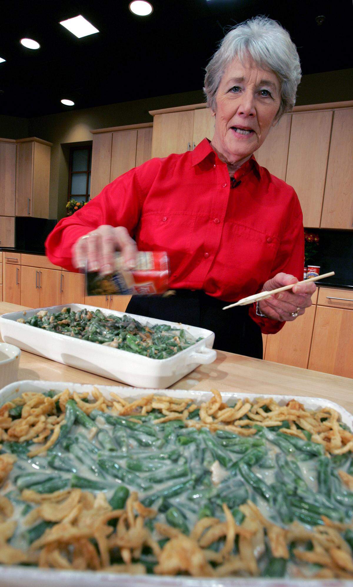 In this Nov. 15, 2005 photo, Dorcas Reilly prepares Green Bean Casserole at the Campbell Soup Co. corporate kitchen in Camden, N.J.  Reilly died on Oct. 15, 2018. She was Campbell’s kitchen supervisor in 1955 when she concocted the recipe for an Associated Press feature. It is the most popular recipe ever to come out of the corporate kitchen at Campbell Soup.