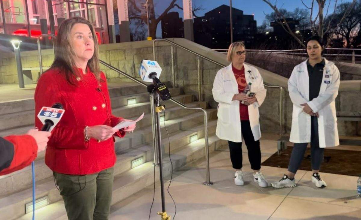 Children’s Mercy’s chief nursing officer Stephanie Meyer, left, speaks at a news conference Wednesday after a shooting injured multiple children at the Kansas City Chiefs’ Super Bowl rally. 
