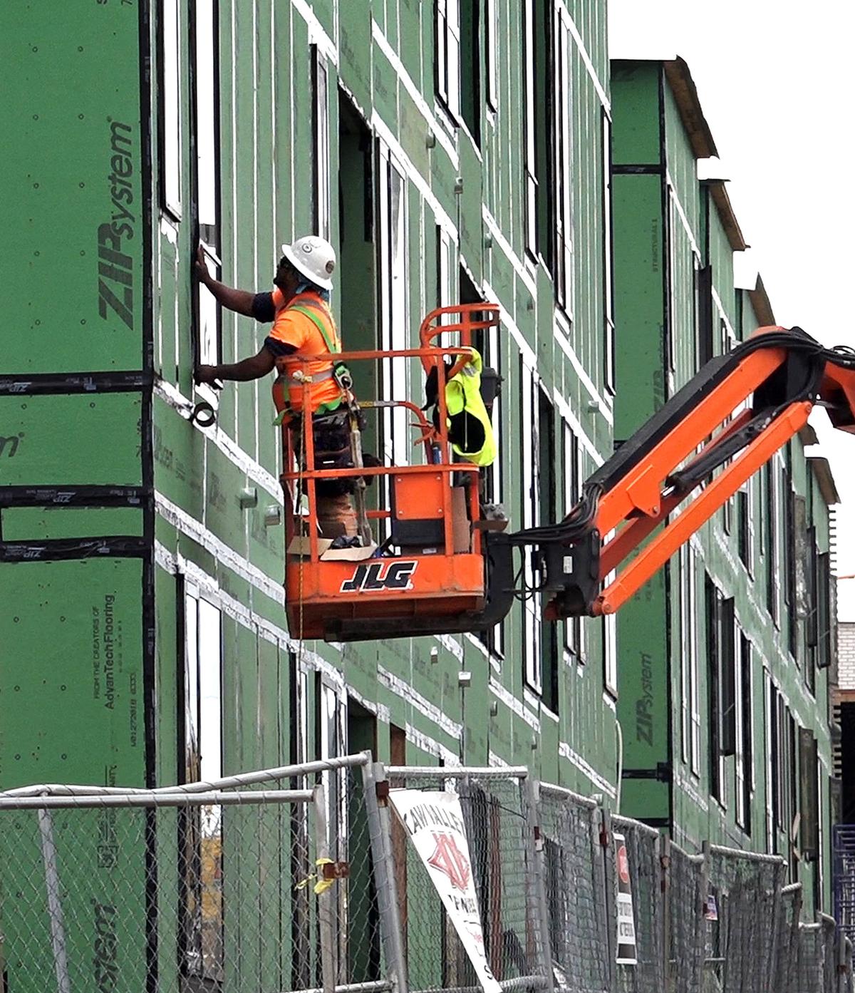 The revitalization of Troost Avenue includes new apartments going up between 26th and 27th streets.