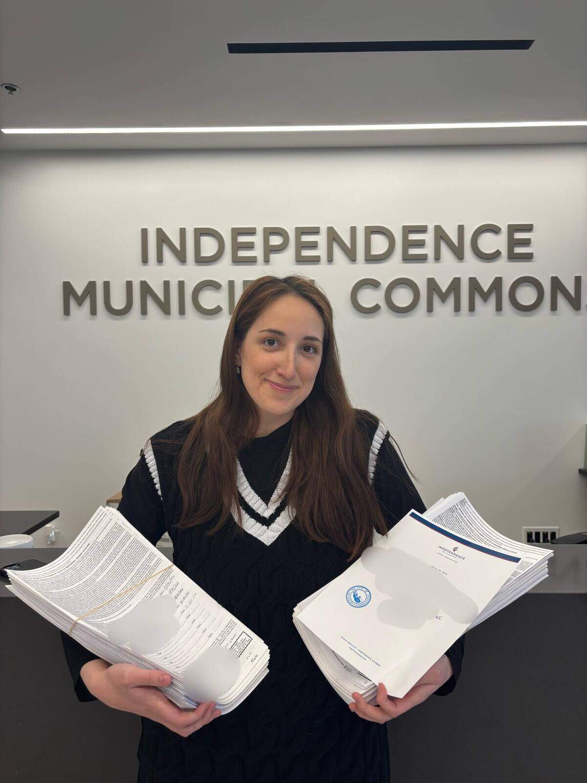 Rachel Gonzalez, an organizer with a group opposing the incoming $150 billion AI data center in Independence, submitted nearly 5,000 signatures in favor of a referendum on tax breaks the city recently passed for the data center. Though a Jackson County judge has ruled to disallow the referendum process from going forward, Gonzalez turned in 113 separate petition pages anyway.