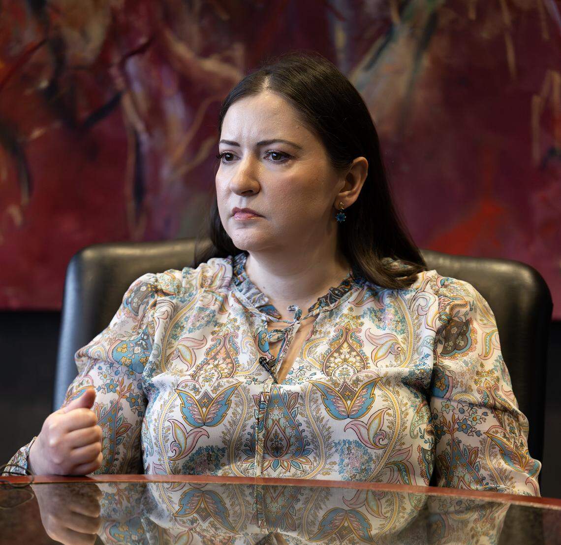 Kristy Schroll sits pensively while being interviewed at her lawyer's office on Friday, March 6, 2026, in Kansas City.