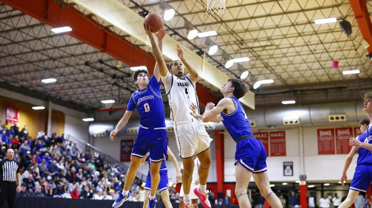 Staley High’s Tavian Tate attempts a shot during the Falcons’ 71-43 win over Rockhurst in the William Jewell Holiday Classic’s Nelson Division championship game on Saturday in Liberty.