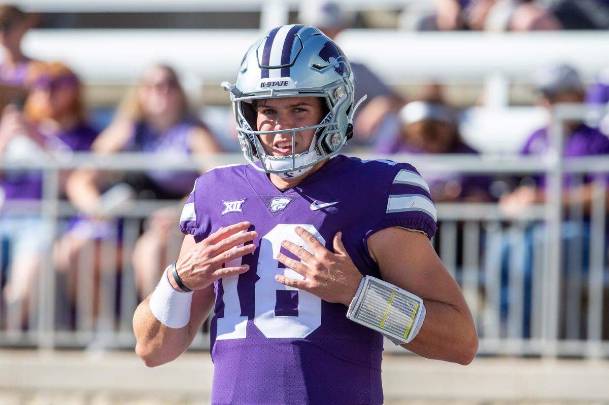 Kansas State Wildcats quarterback Will Howard (18) adjusts his shoulder pads before a game against the South Dakota Coyotes at Bill Snyder Family Football Stadium on Sept. 3, 2022.
