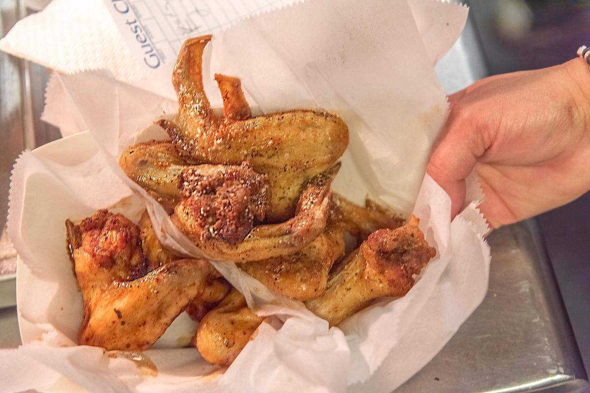 Chicken wings, fresh out of the fryer.
