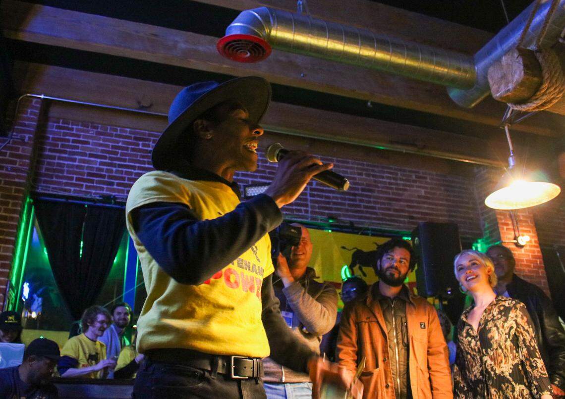 Hartzell Gray starts a chant with KC Tenants, who opposed the stadium tax, after the final tally came in Tuesday night. Kansas City District 6 Councilmember Johnathan Duncan looks on in the background.