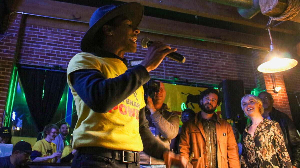 Hartzell Gray starts a chant with KC Tenants, who opposed the stadium tax, after the final tally came in Tuesday night. Kansas City District 6 Councilmember Johnathan Duncan looks on in the background.