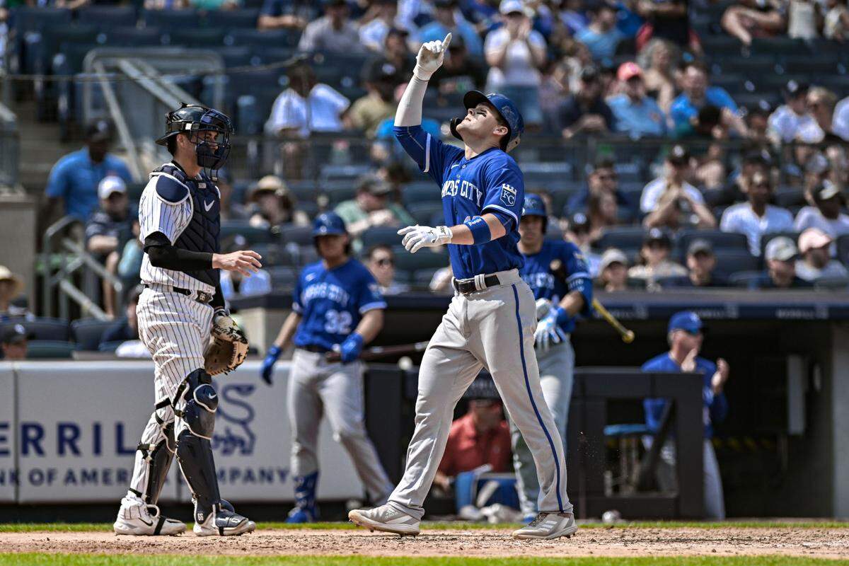Royals second baseman Michael Massey crosses home plate after hitting a two-run home run against the New York Yankees on Sunday at Yankee Stadium.