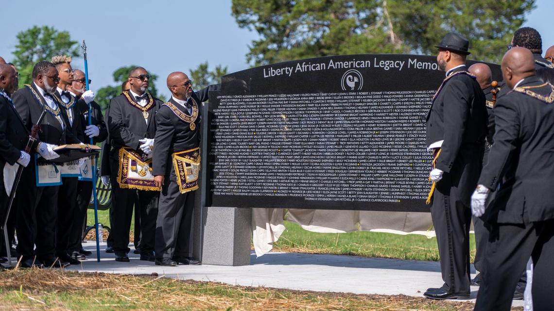 Representatives of the Most Worshipful Prince Hall Grand Lodge of Missouri Jurisdiction unveil the Liberty African American Legacy Memorial at Fairview and New Hope Cemetery in Liberty on Saturday, June 18, 2022.