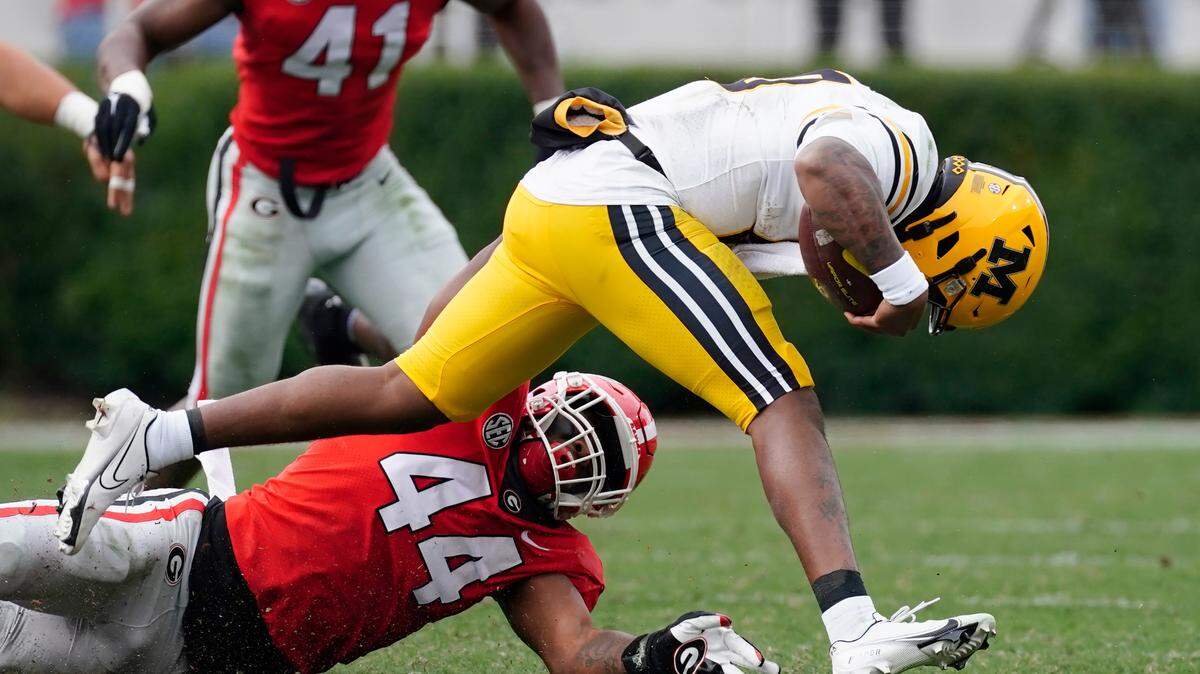 Missouri quarterback Tyler Macon (10) is stopped by Georgia defensive lineman Travon Walker (44) in the first half of an NCAA college football game Saturday, Nov. 6, 2021, in Athens, Ga.. (AP Photo/John Bazemore)