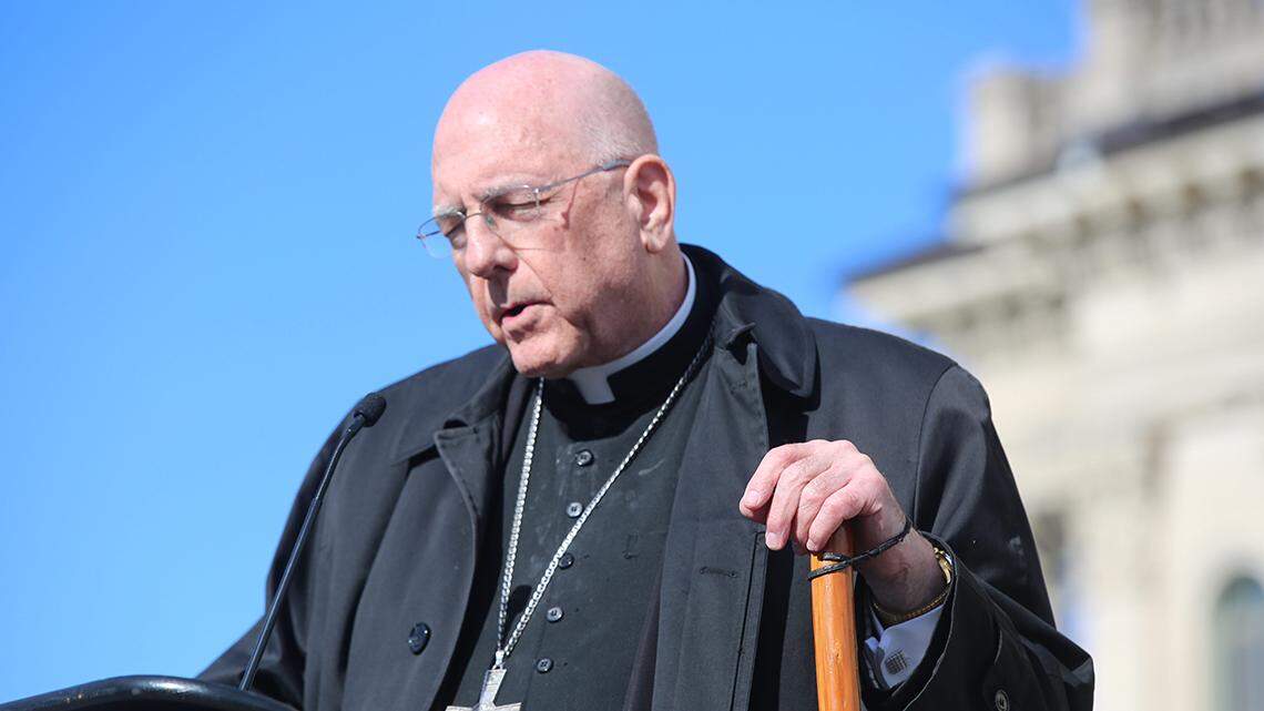 Joseph Naumann, archbishop of Kansas City, Kan., prays at the march for life on Wednesday at the Statehouse.