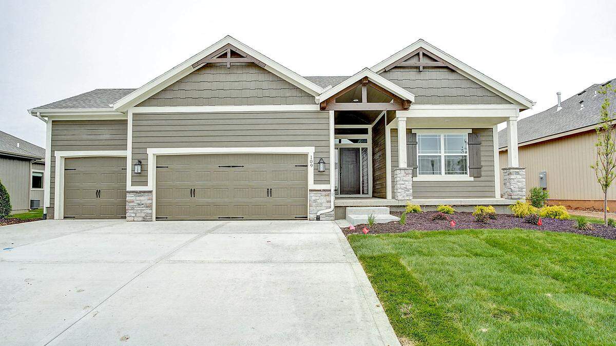 Summit’s Care Free homes are recognizable by the front elevation designated to the community. Pictured here is the Craftsman option with shaker shingles and decorative wooden corbels.