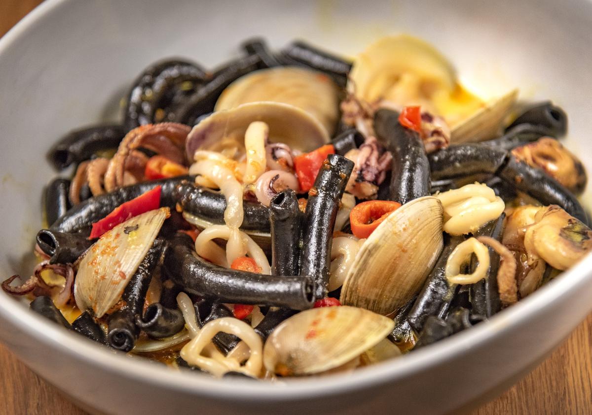 Lazia’s Cuttlefish Ink Spaccatelli with clams, mussels, baby octopus, saffron cream and Calabrian chili.